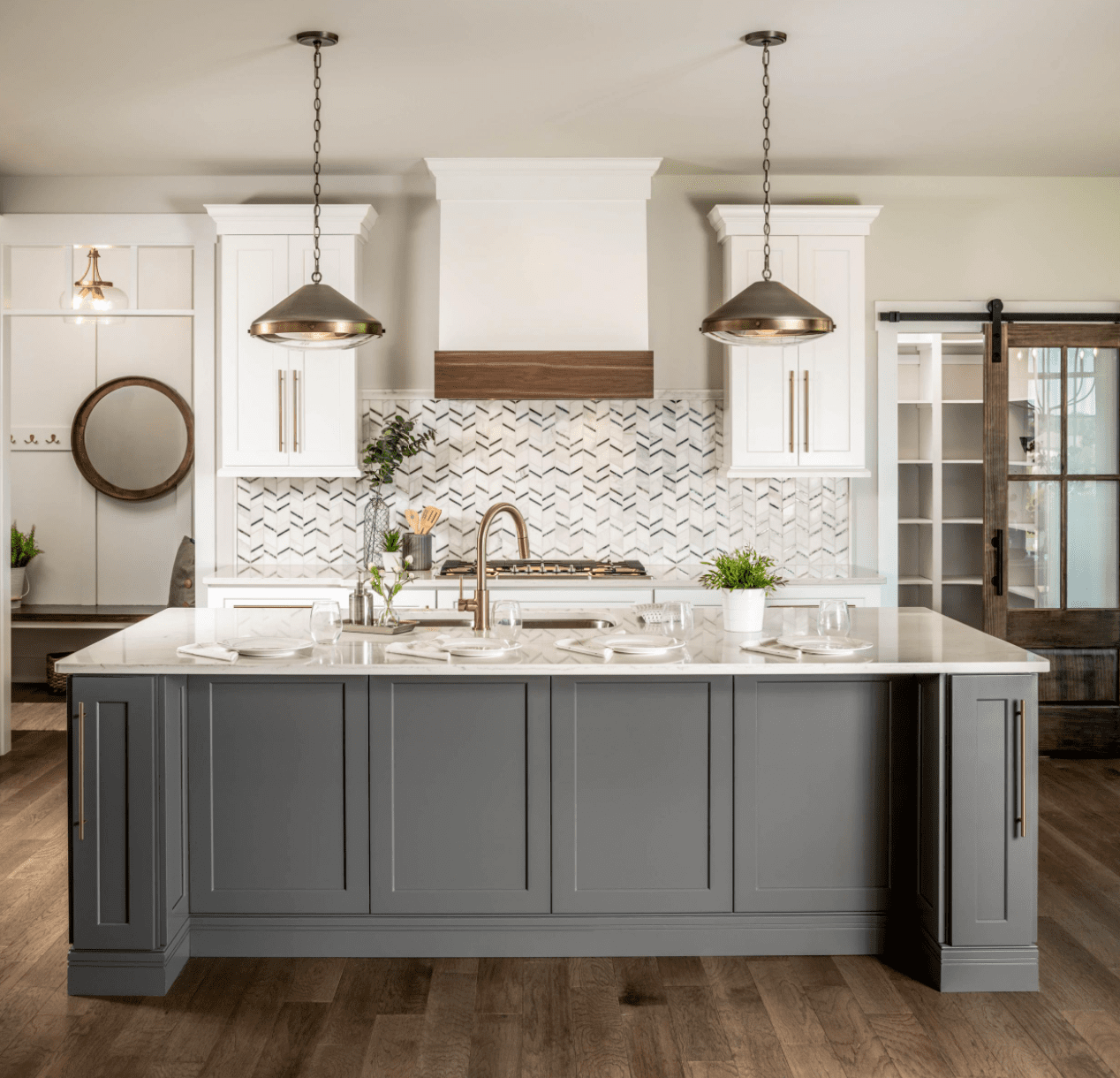 Large kitchen island with bar and sink.