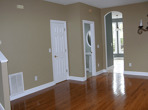 Interior painting with light olive walls and white trim.